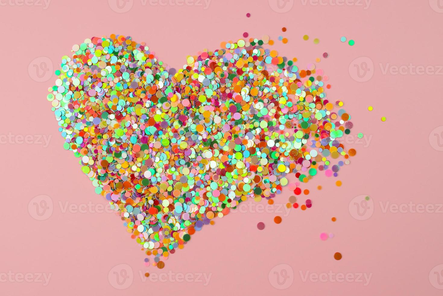 Heart Shape made of paper confetti. Breaking heart scatter. Broken heart, hurt feeling, end of love photo