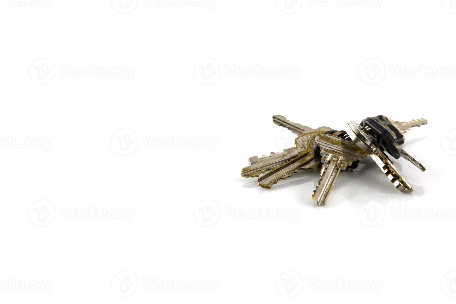 Large bunch of keys isolate on white background photo