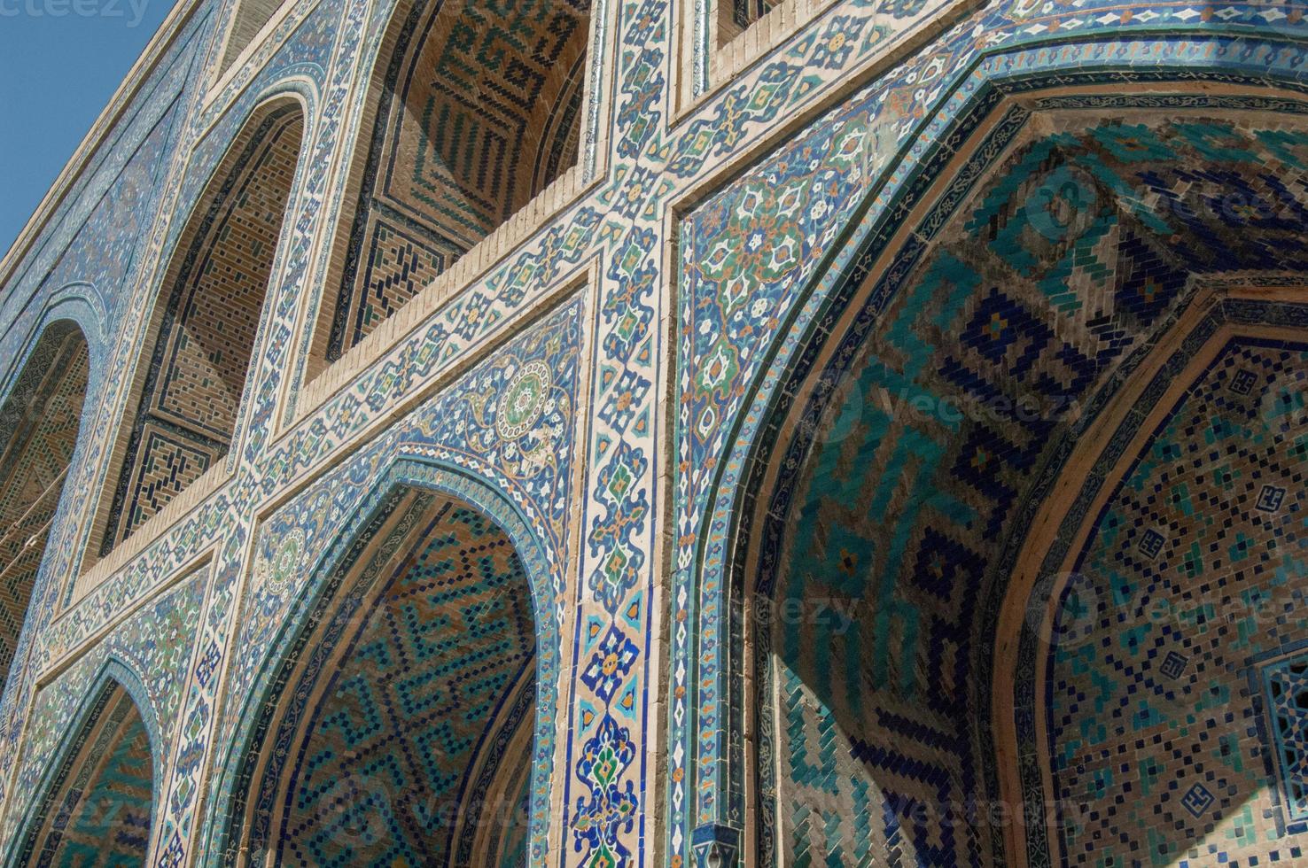 Arch and architecture of the ancient Registan in Samarkand. Ancient architecture of Central Asia photo