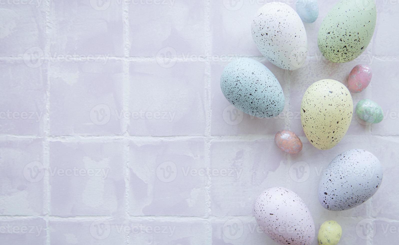 Colorful Easter eggs on tile background photo