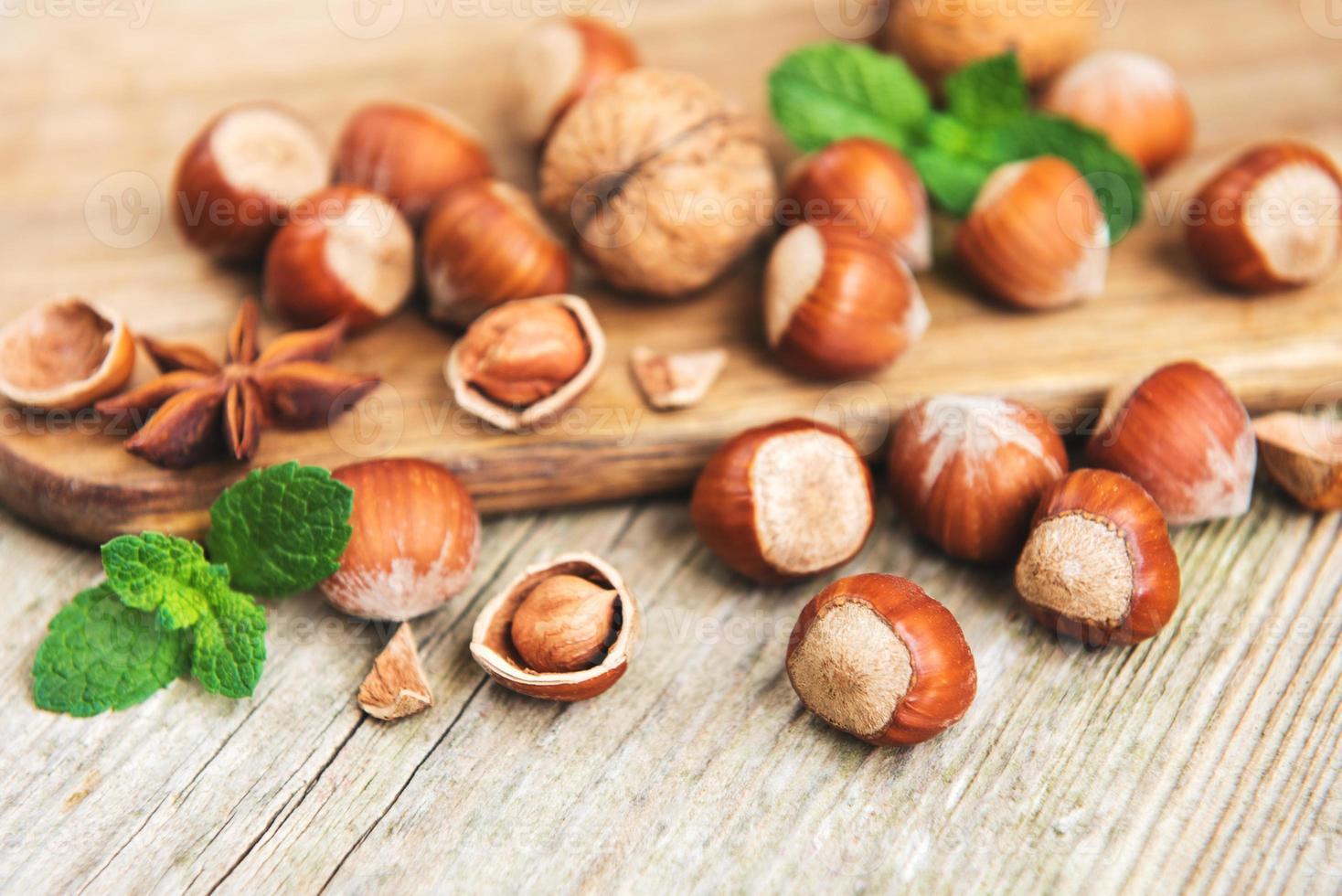 Hazelnuts on a old wooden table photo