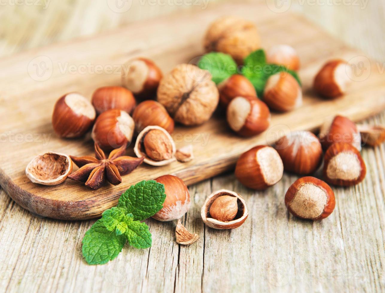 Hazelnuts on a old wooden table photo