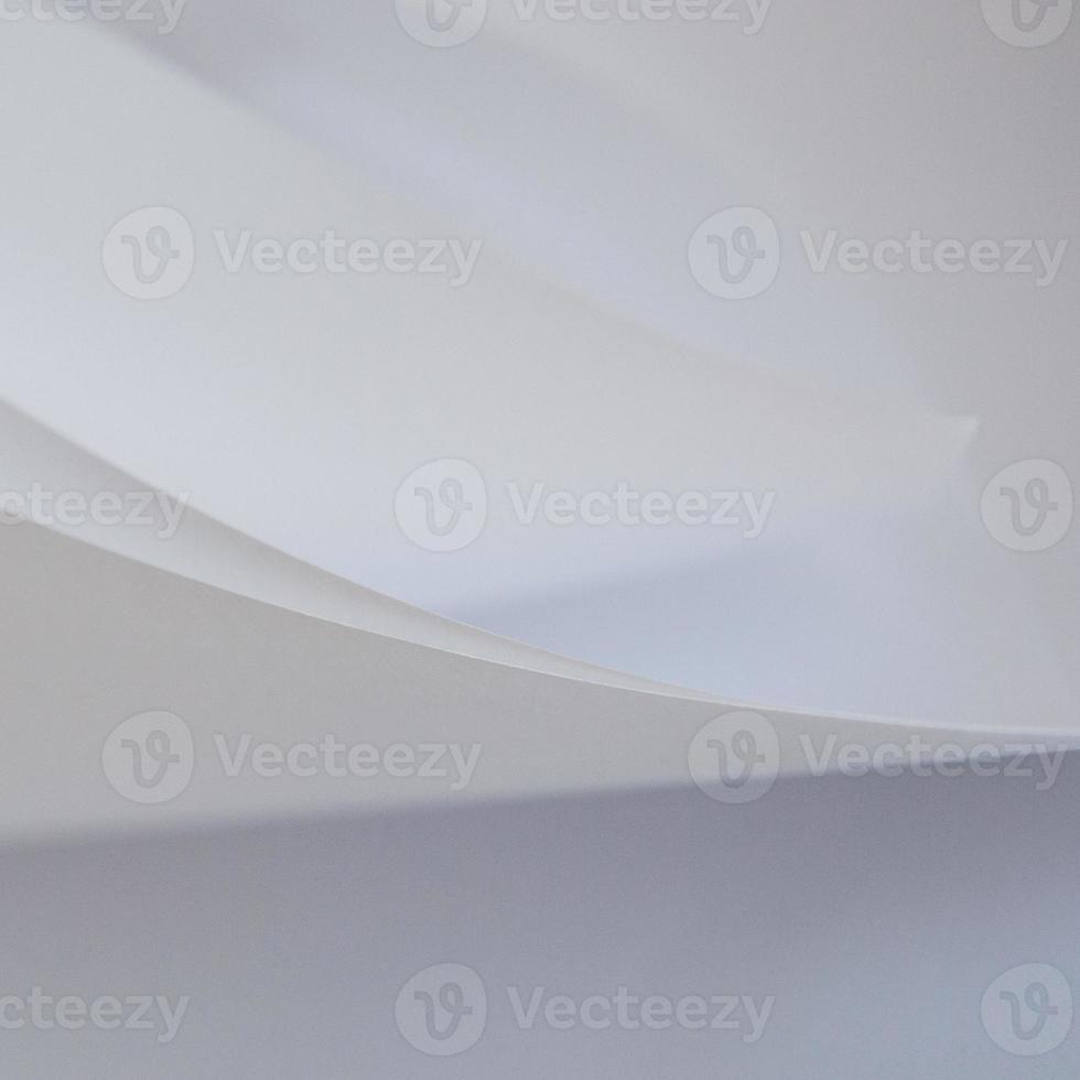 abstract background of a twisted sheet of white paper photo