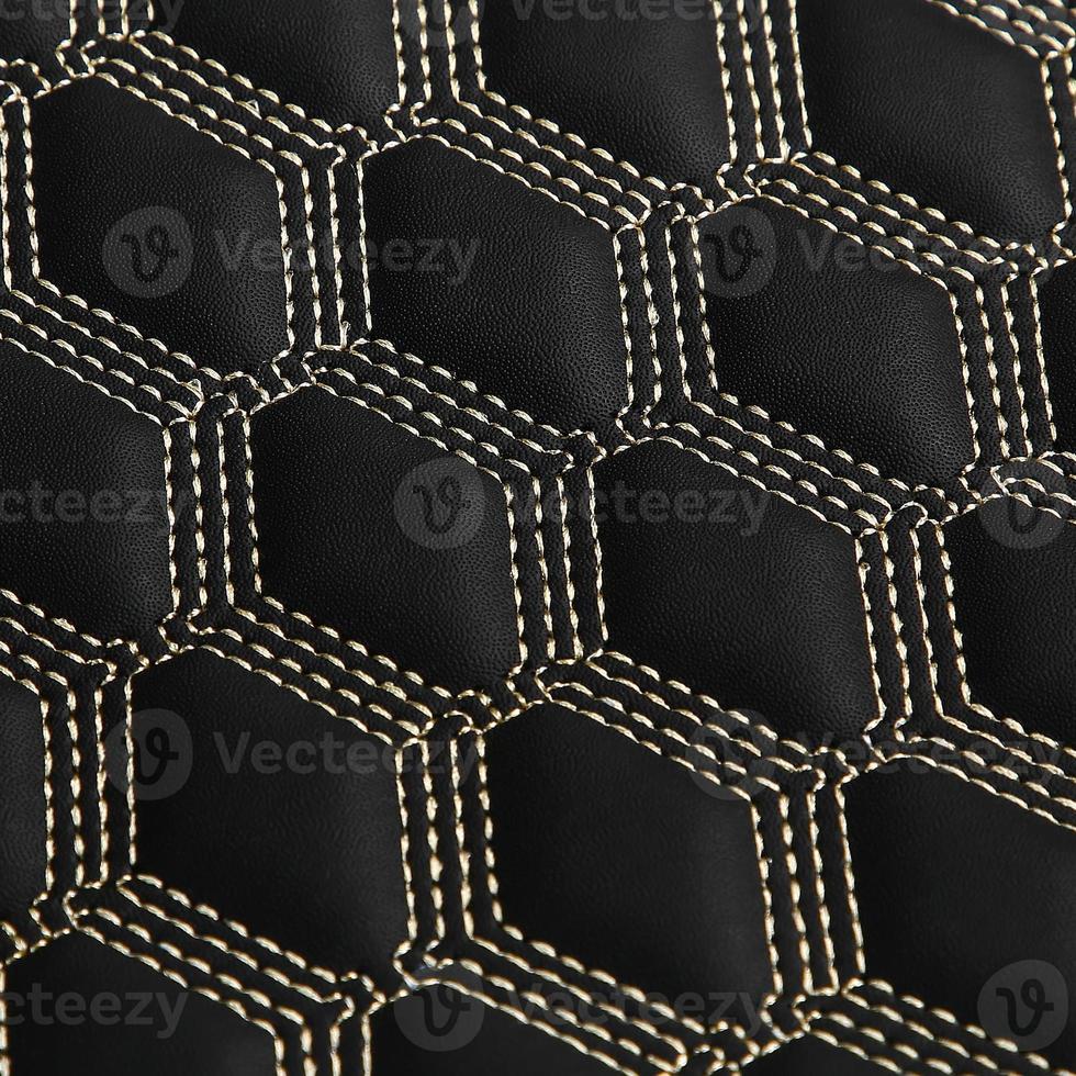 textura de fondo de cuero negro con patrón cuadrado y puntada, macro foto