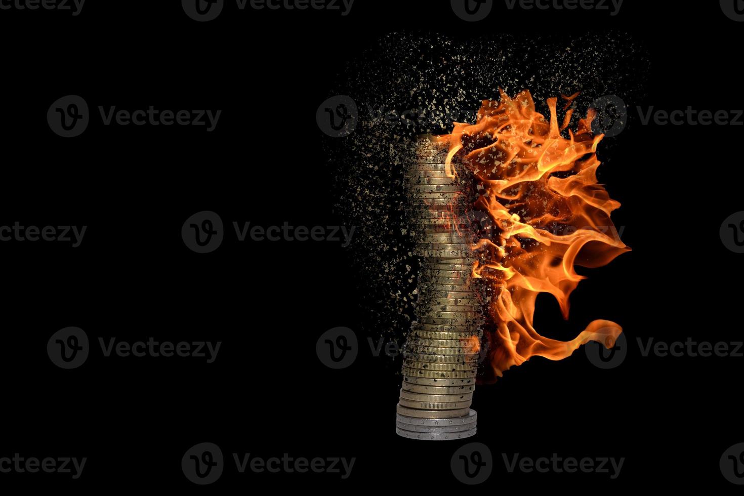 stack of many burning coins decomposes and dissolves due to inflation with black photo