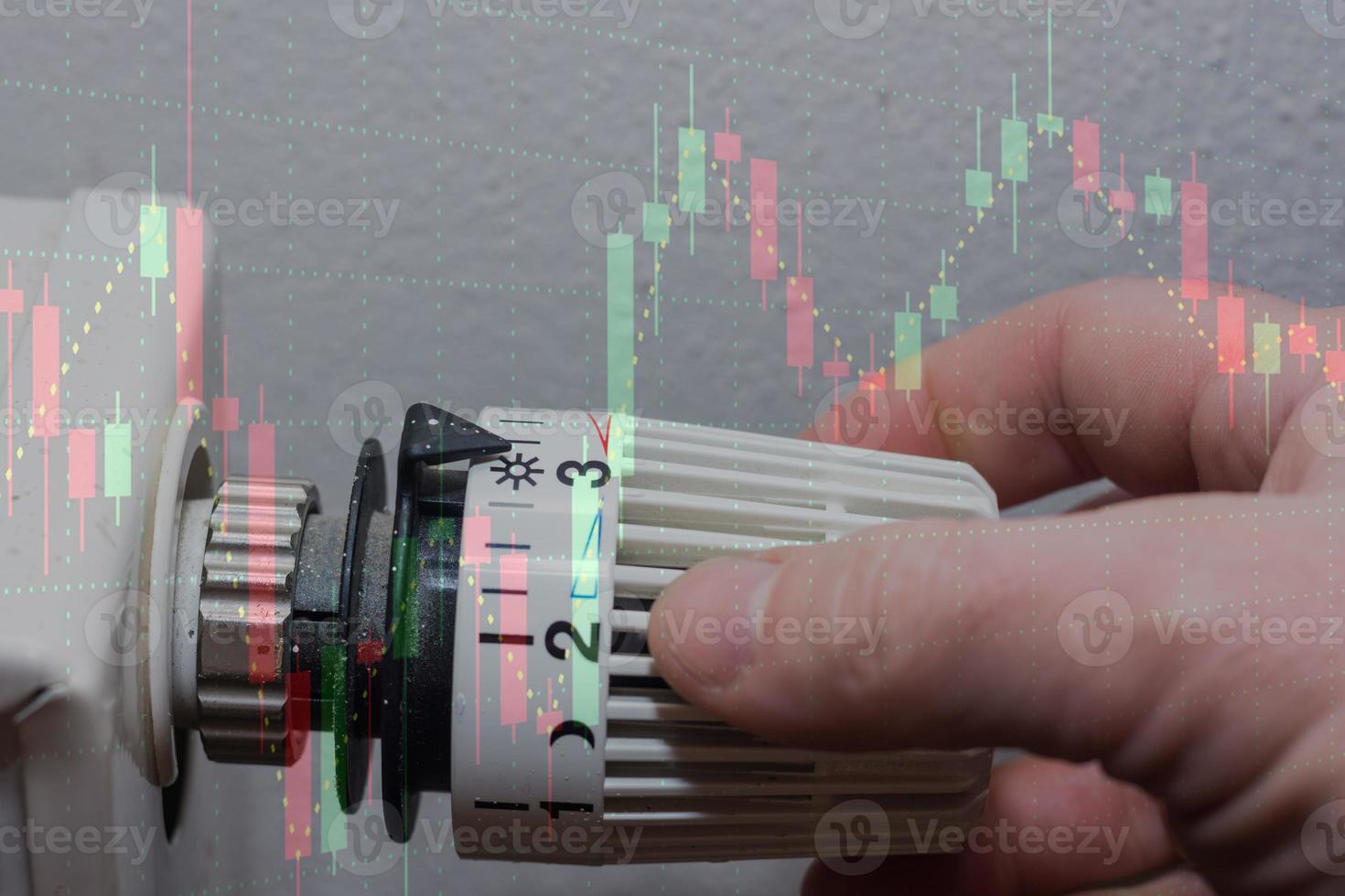 Energy prices increase and energy consumption turning on a thermostatic regulator with a chart photo