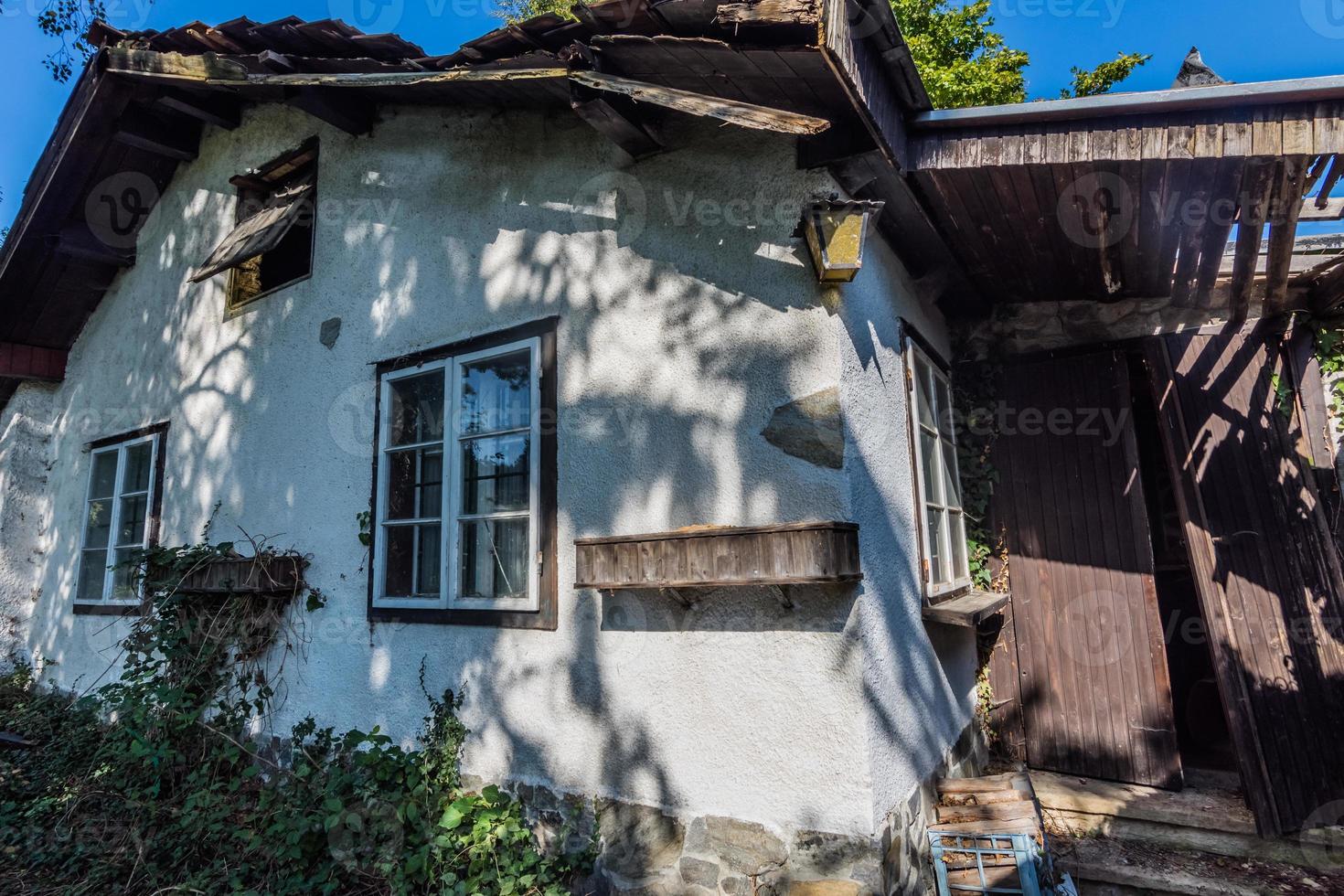 little old abandoned house in the forest photo