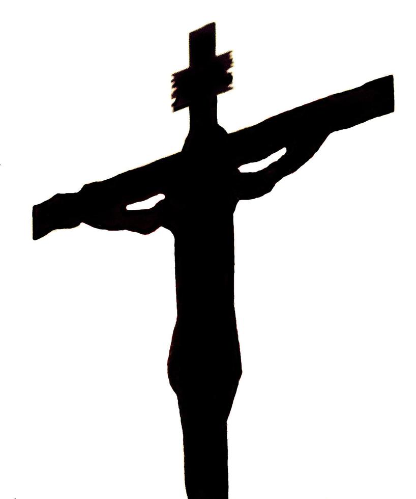 Silhouette of the crucified Jesus on a white background. photo