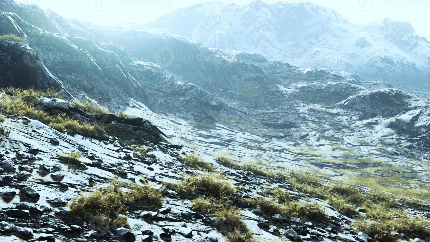 lanscape with barren mountain which is covered with ice photo