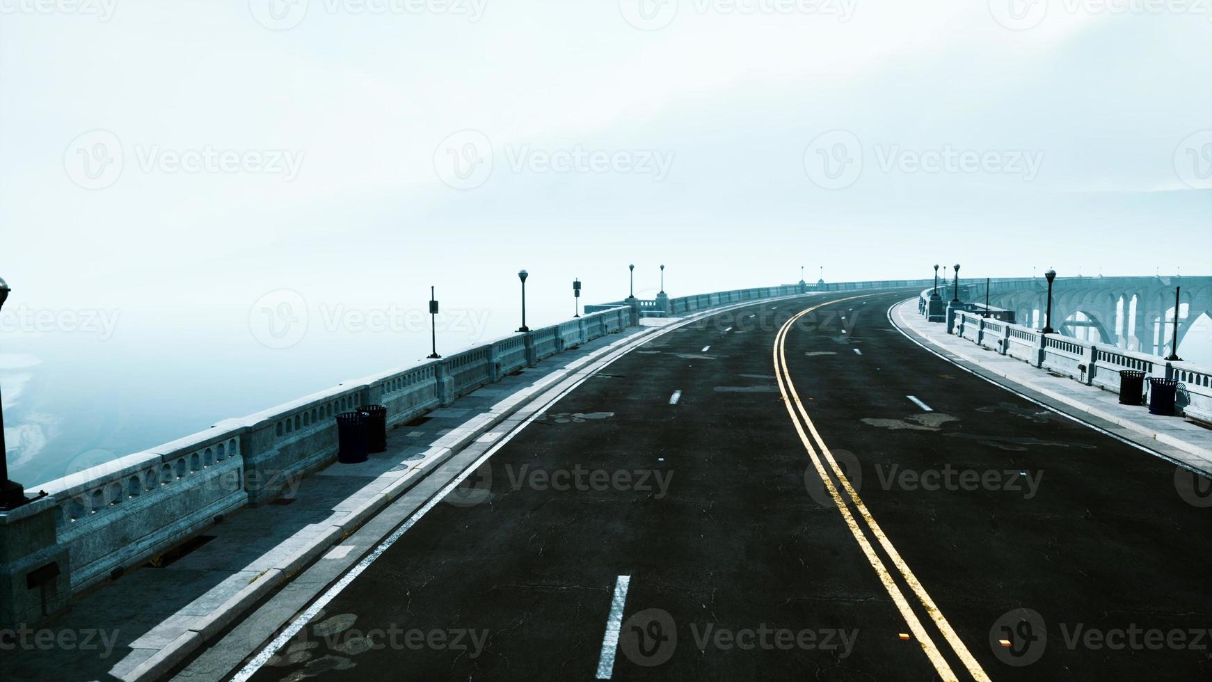 illuminated empty road bridge in a fog photo