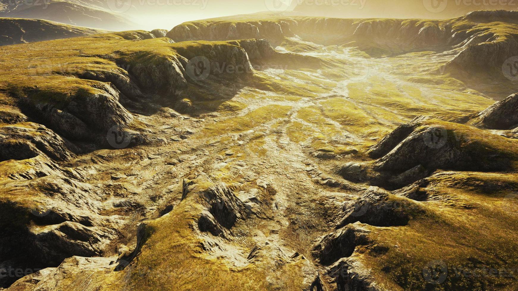 Grasslands wide panorama with autumn grass field and mountains photo