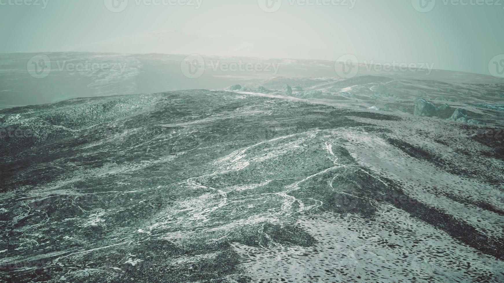 snow ice and rocks at northern landscape photo