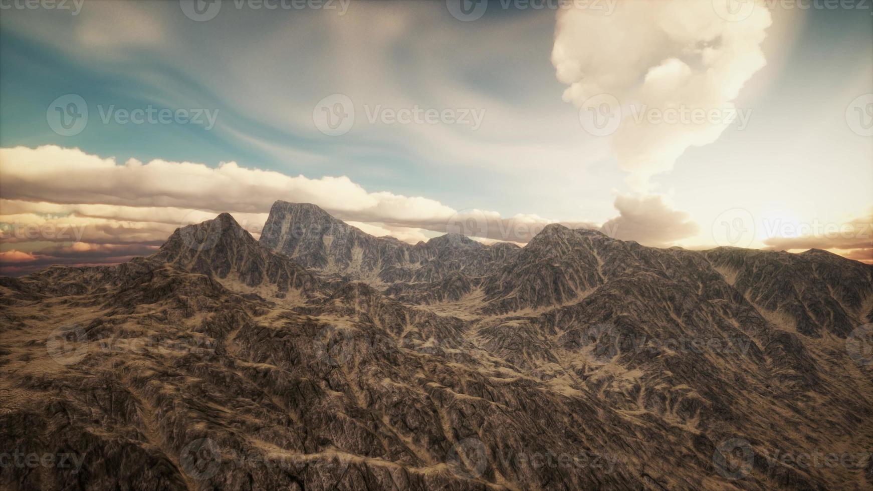 Sun Rays against the Backdrop of the Mountains photo