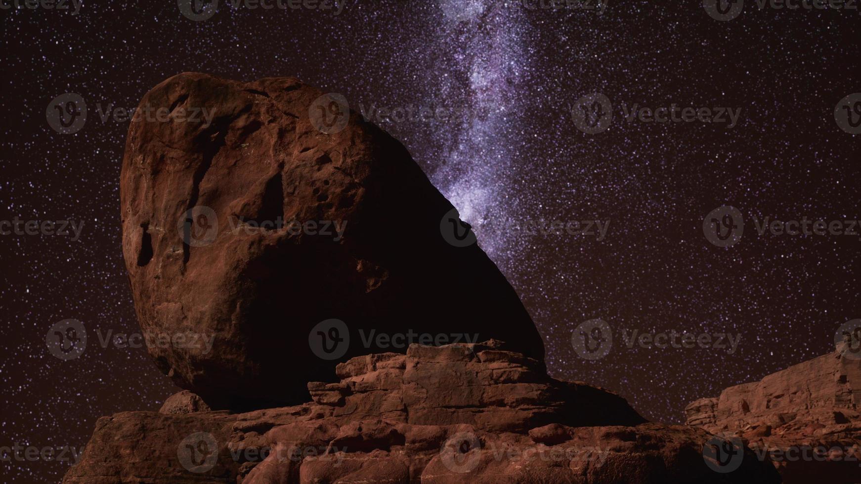 red rocks and milky way night sky in Moab Utah photo