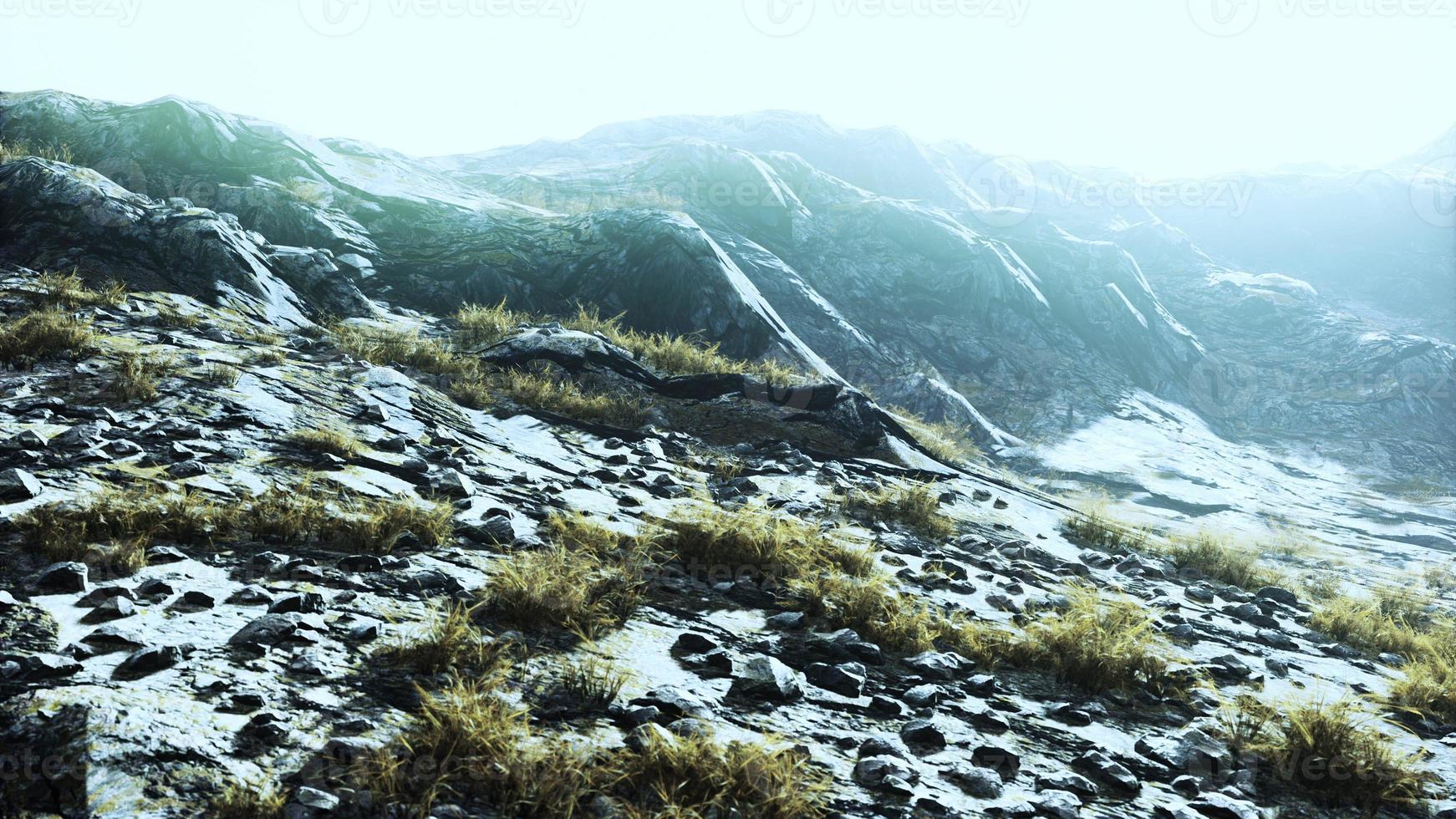 landscape of mountains with dry grass in summer season photo