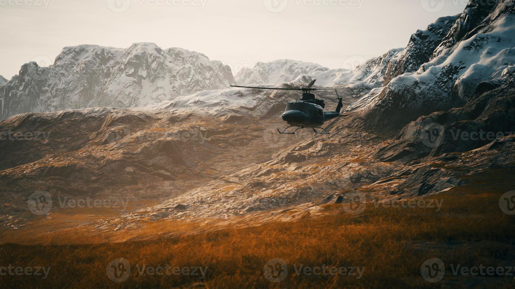 slow motion Vietnam War era helicopter in mountains photo