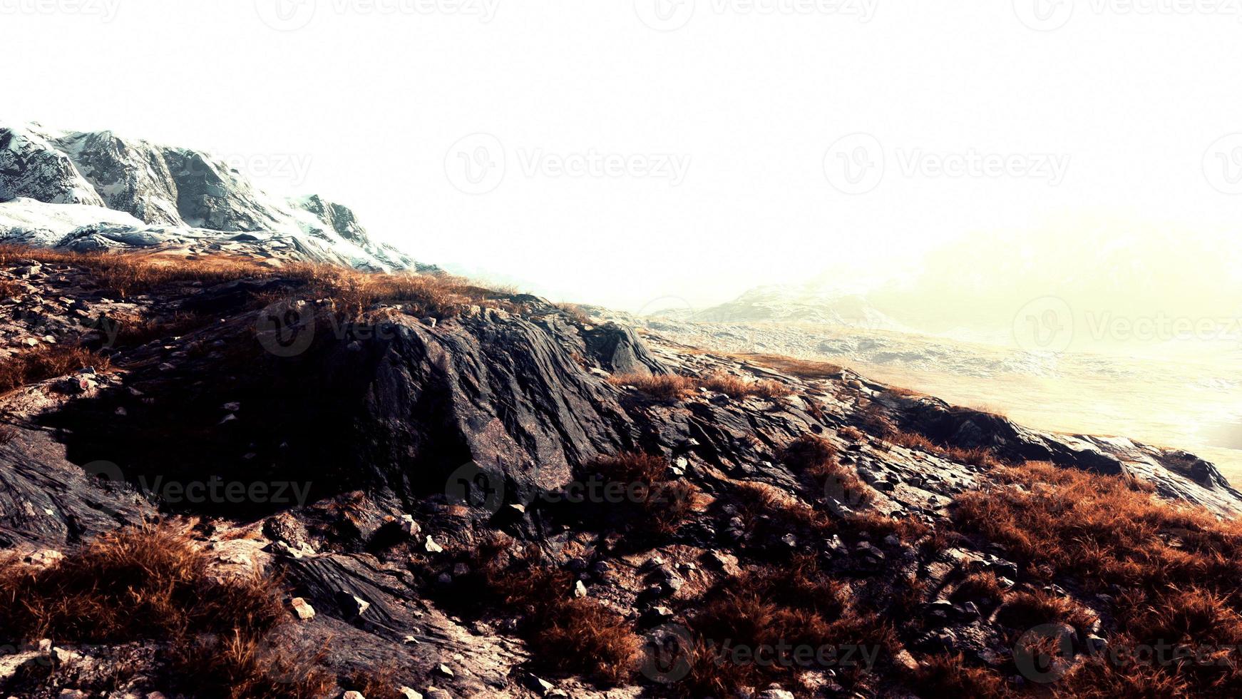 landscape of mountains with dry grass in summer season photo