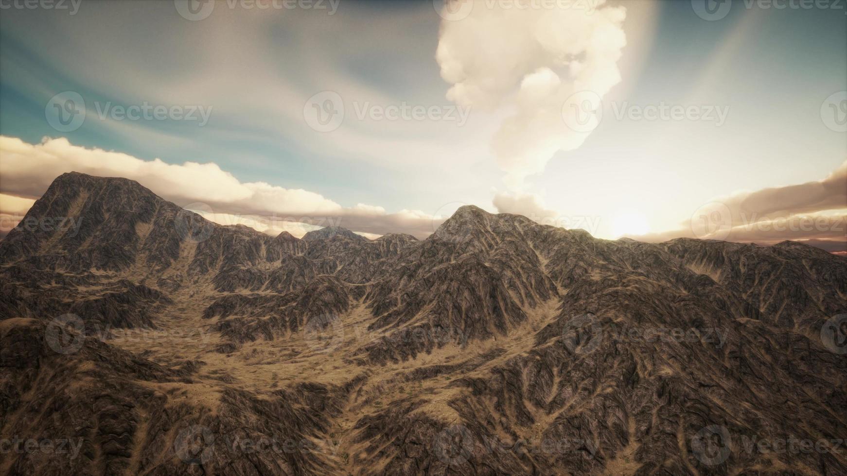 Sun Rays against the Backdrop of the Mountains photo