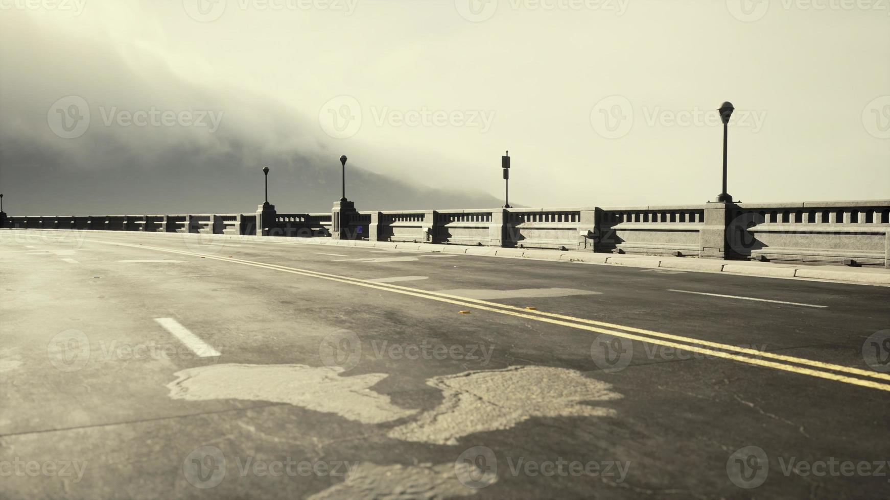 View of the bridge over the river in fog photo
