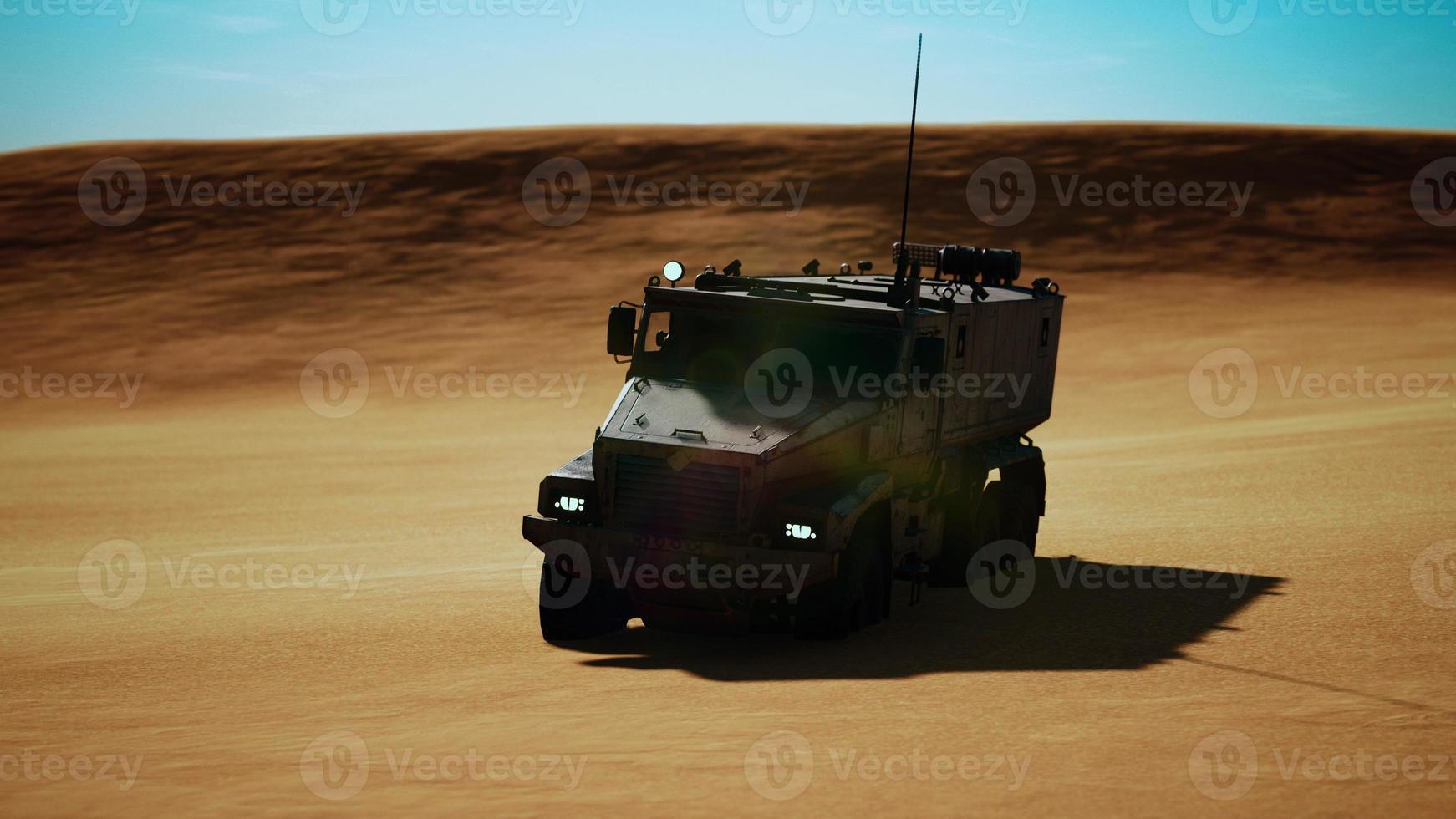 Armoured military truck in desert photo
