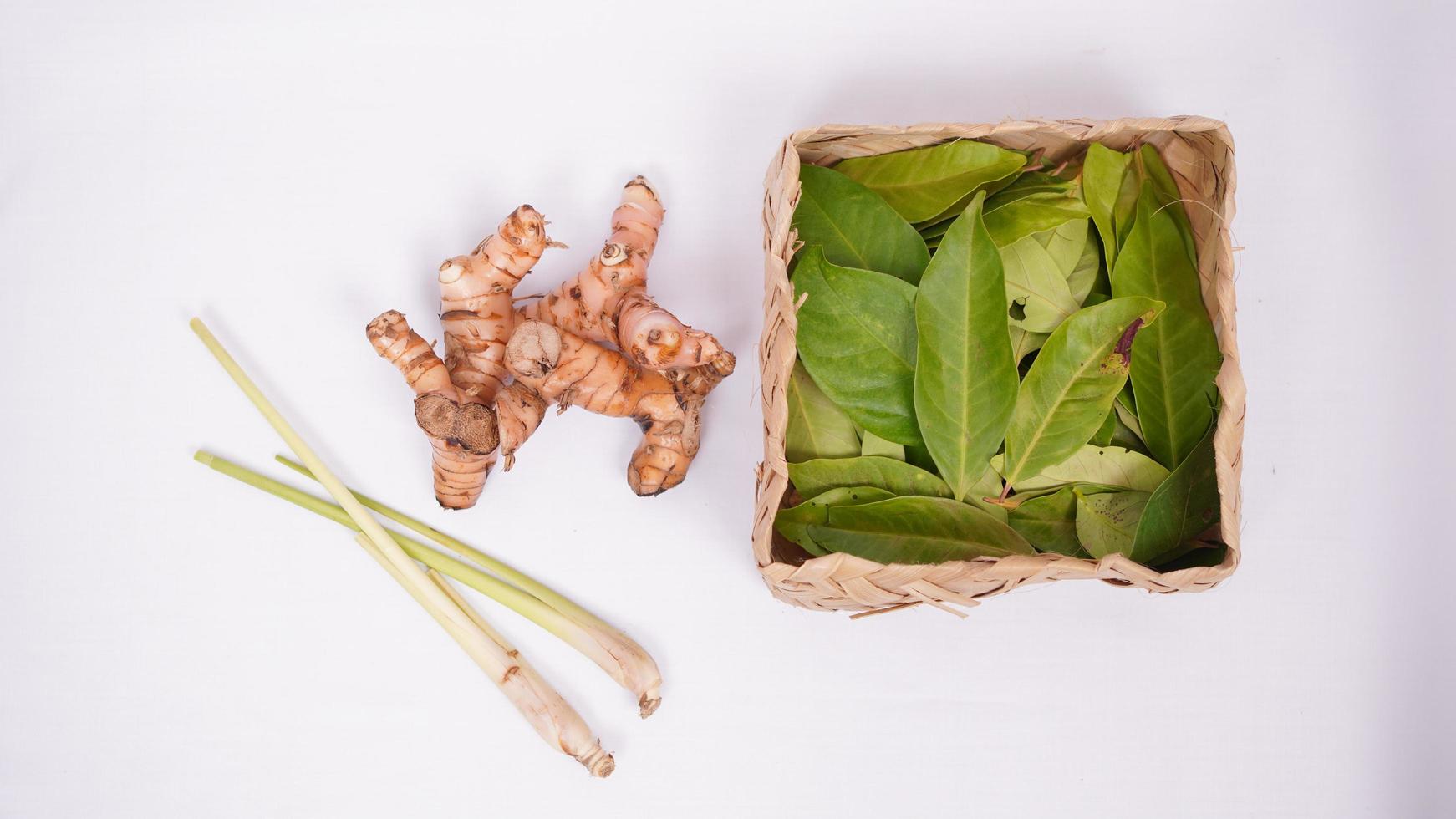 various spices, lemongrass, bay leaves and galangal isolated on white background photo