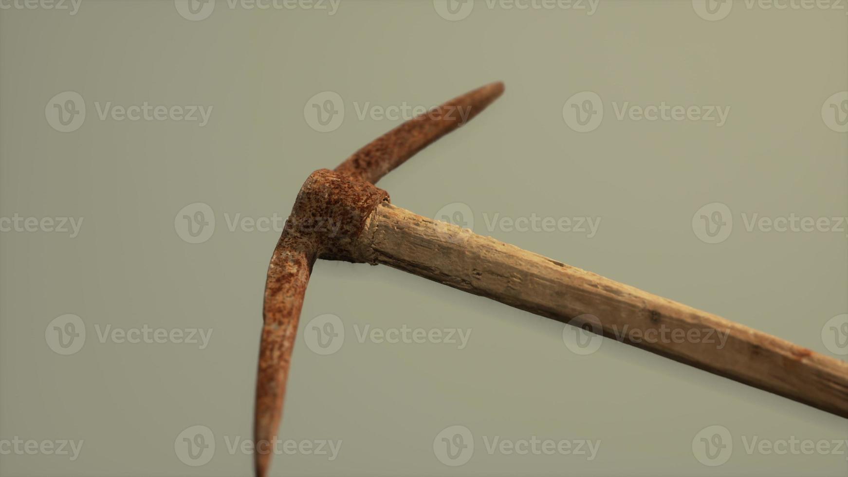 Close up of an old rusted pickaxe head photo