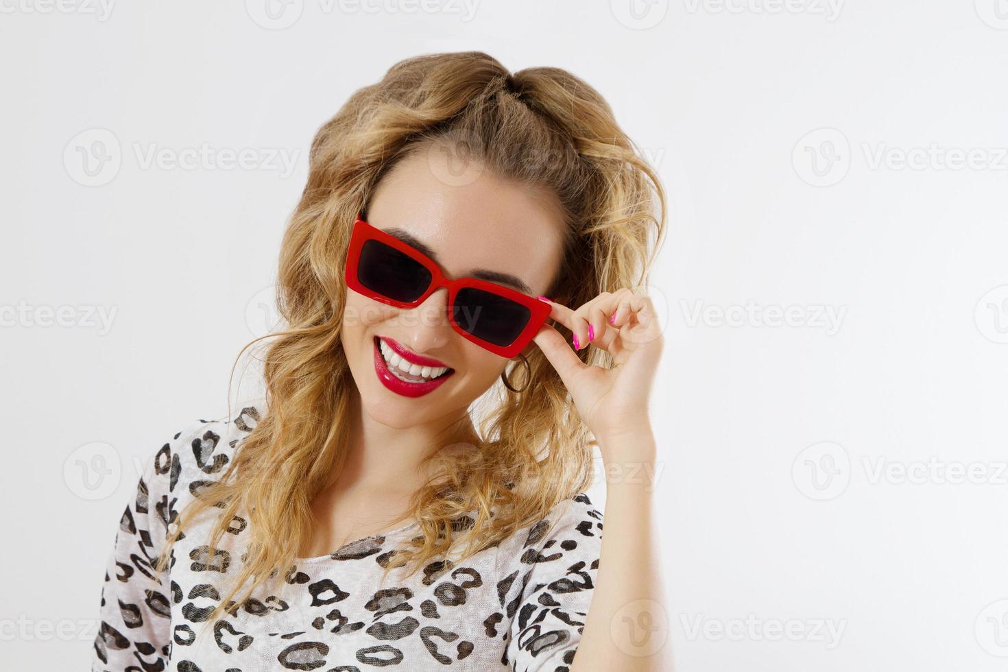 Close-up woman face. Fashion female closeup in trendy clothes isolated on white background. Summer fun time and summertime accessories. Funny girl. photo