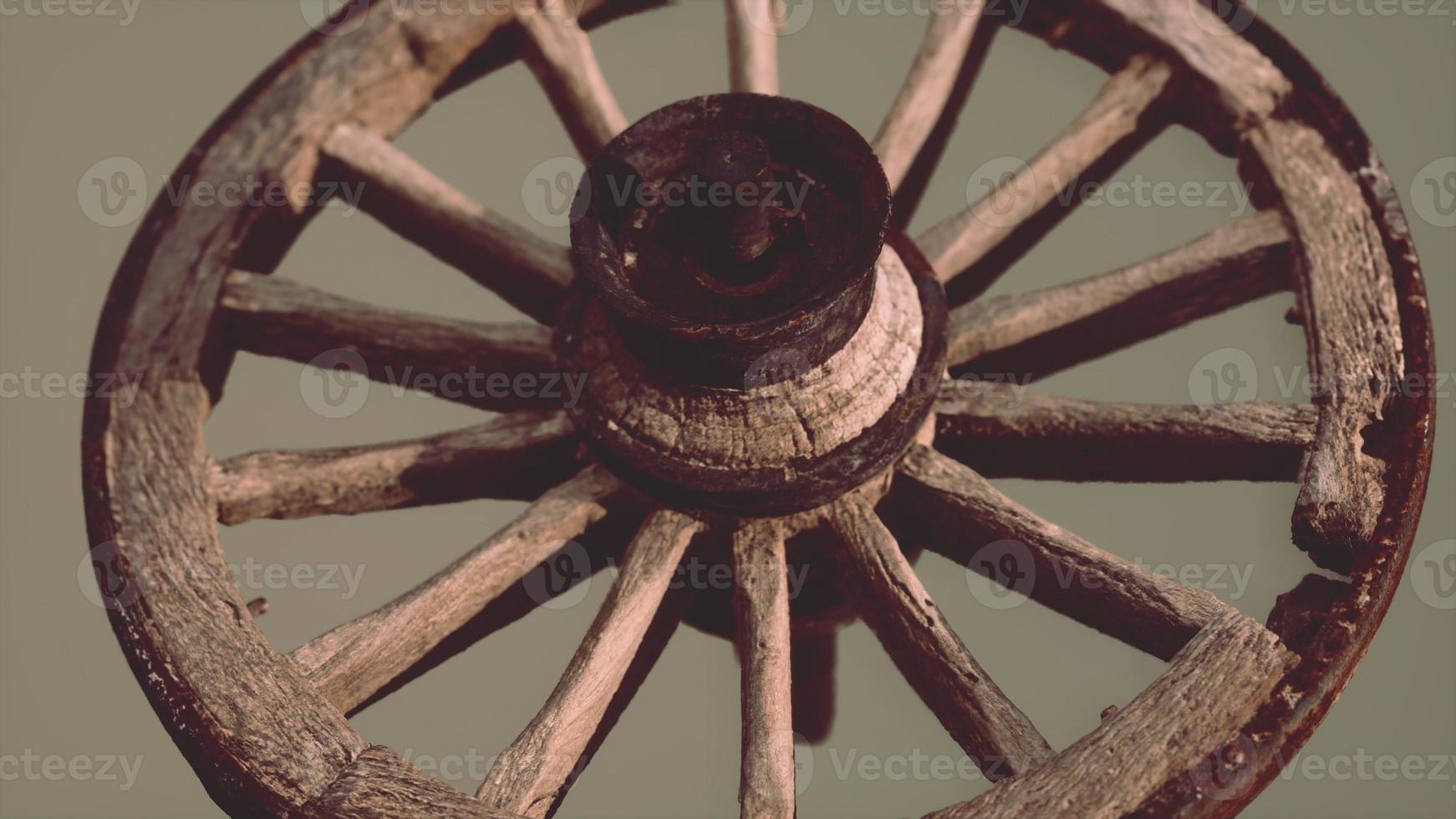 Handmade rustic vintage wooden wheel used in medieval wagons photo