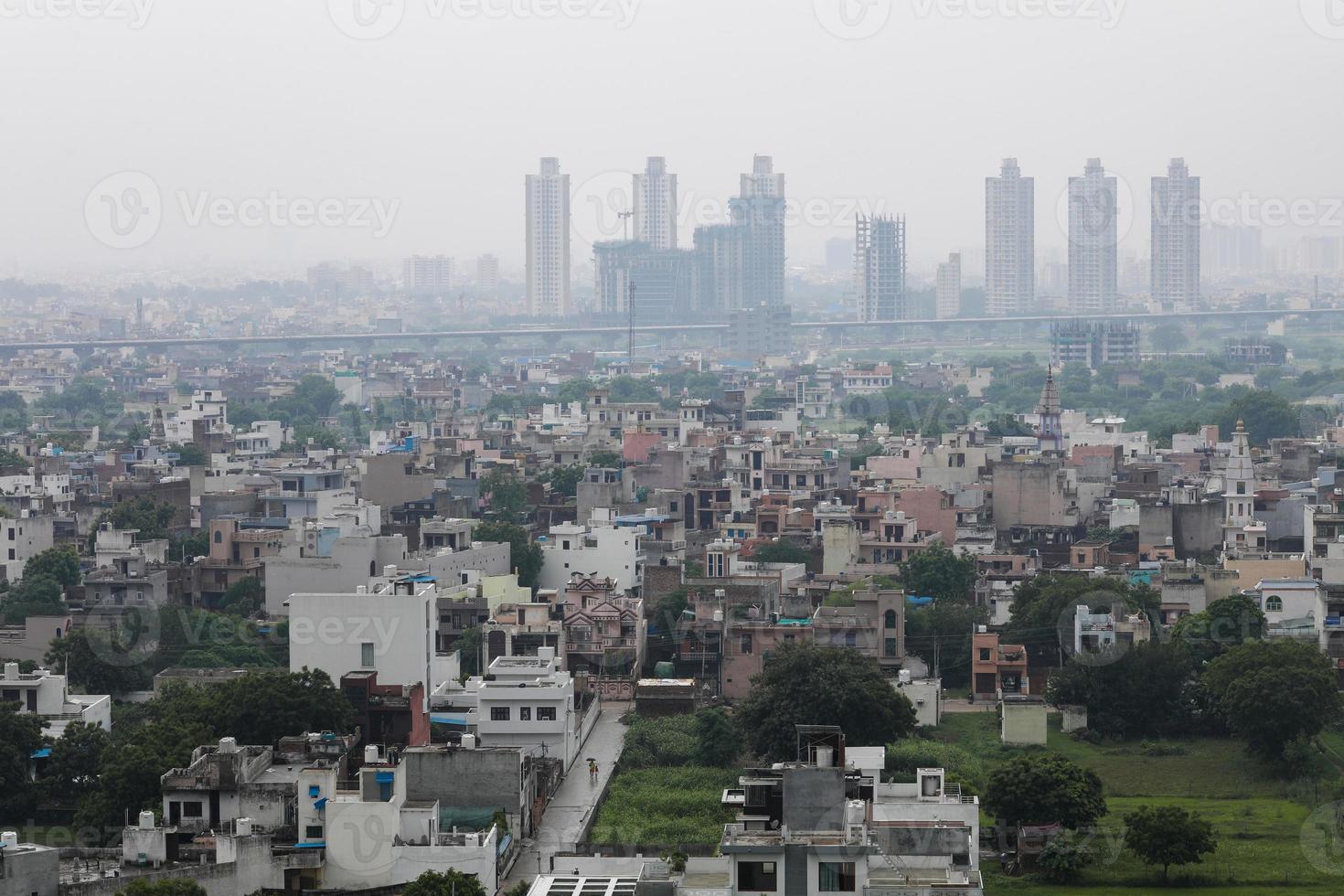 aerial landscape view of Dwarka Expressway, showing the contrast of villages and tall building. photo