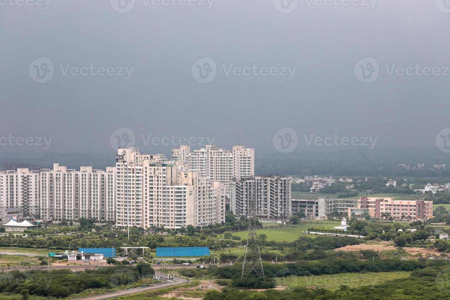 Arial view Cityscape in Gurgaon, Noida, Jaipur, Delhi NCR, Lucknow, Mumbai, Bangalore, Hyderabad showing small houses sky scrapers other commercial real estate infrastructure photo