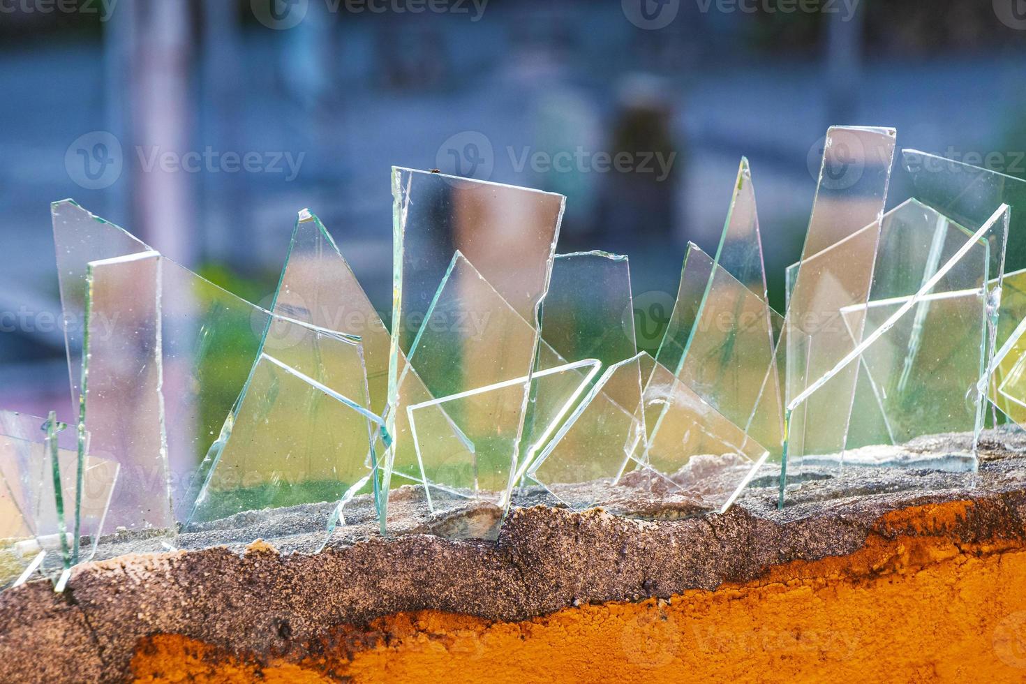 Dangerous wall with broken glass shards Playa del Carmen Mexico. photo