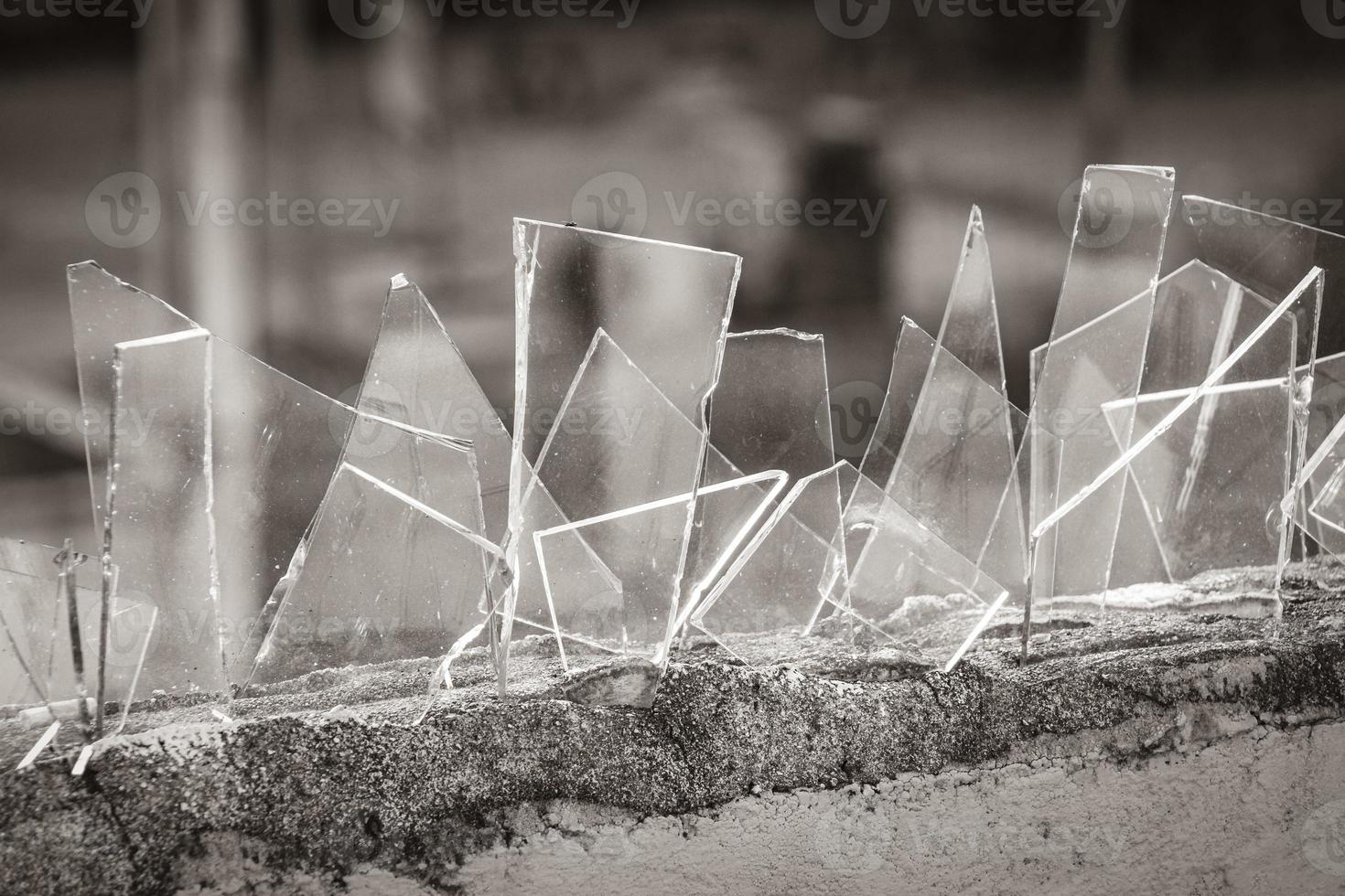 Dangerous wall with broken glass shards Playa del Carmen Mexico. photo