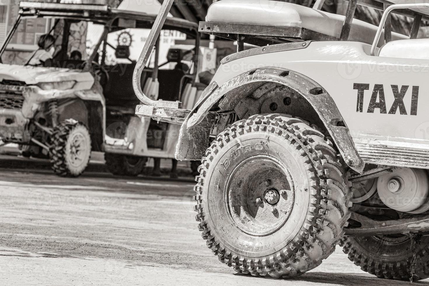 Golf cart taxi cars carts wheel street beach Holbox Mexico. photo