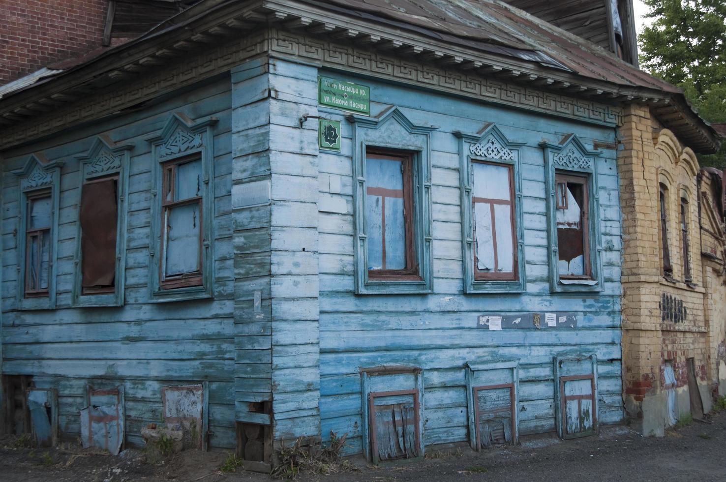 - Kazan, Russia- 08032001- Beautiful blue wooden house in Kazan, Russia. View of the street with no people photo