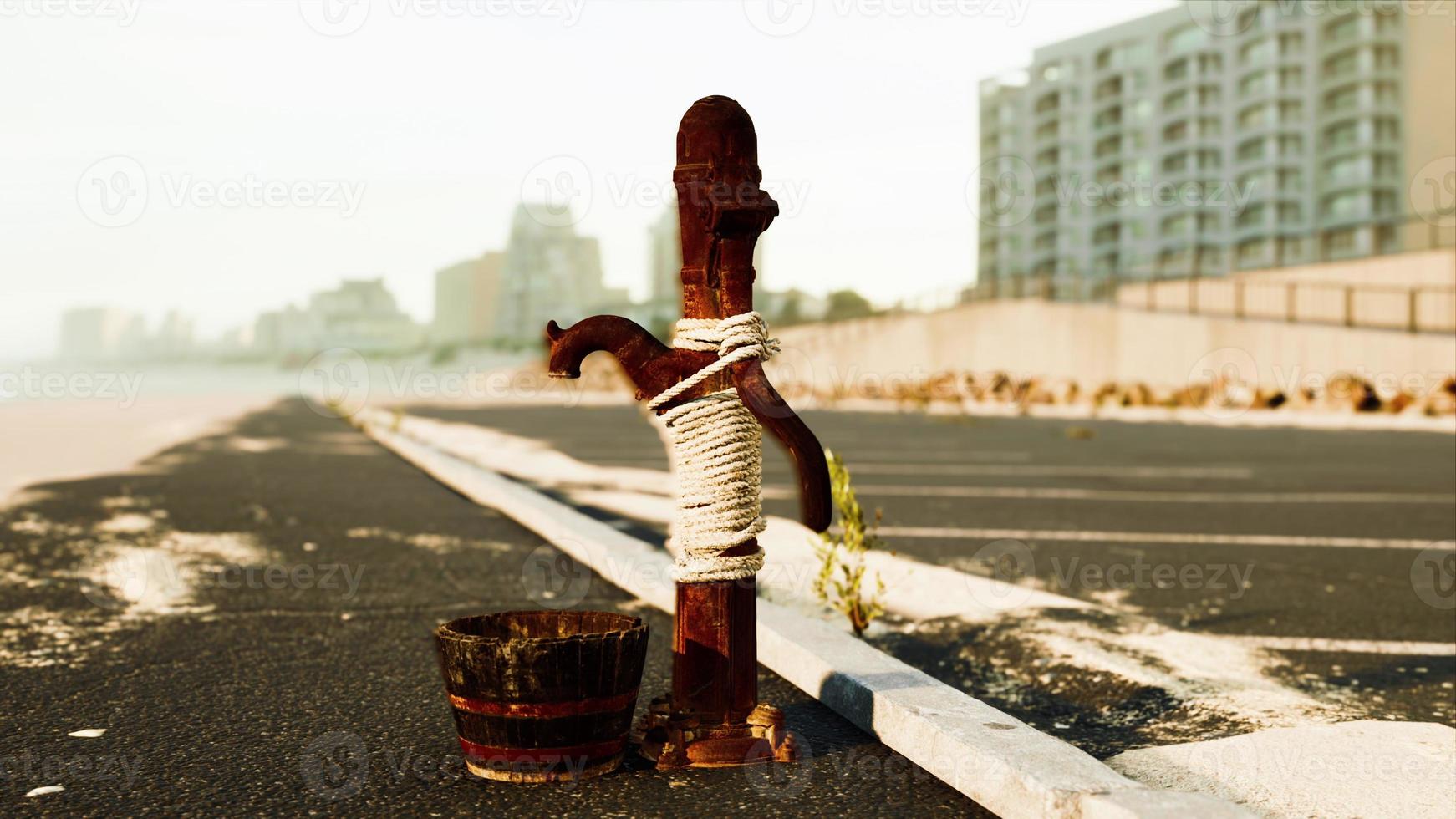 old rusty water pump at sunny day photo