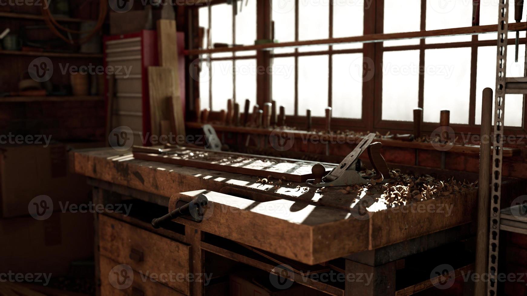 Retro stylized old tools on wooden table in a joinery photo
