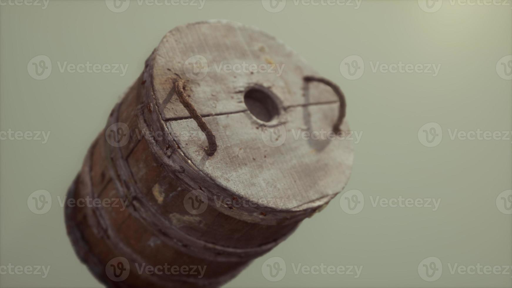 Old used rusted wooden bucket photo