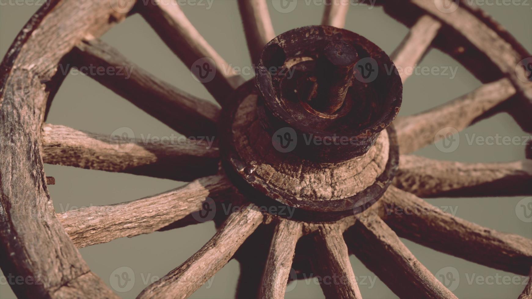 Handmade rustic vintage wooden wheel used in medieval wagons photo