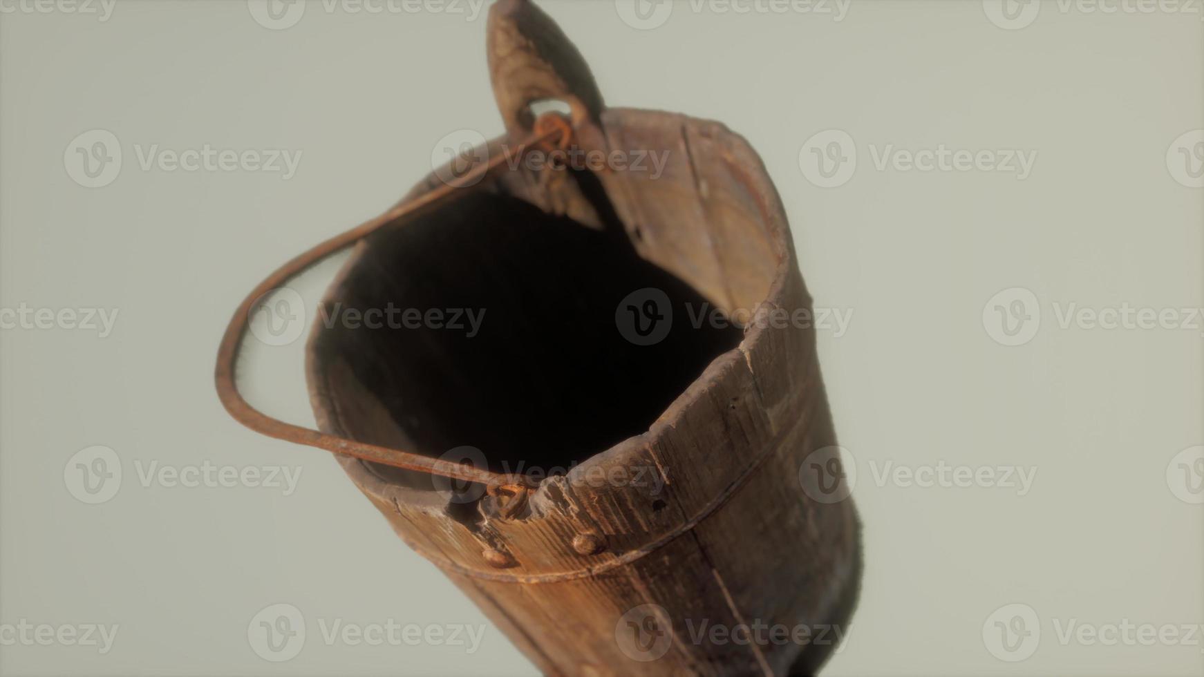 Old used rusted wooden bucket photo