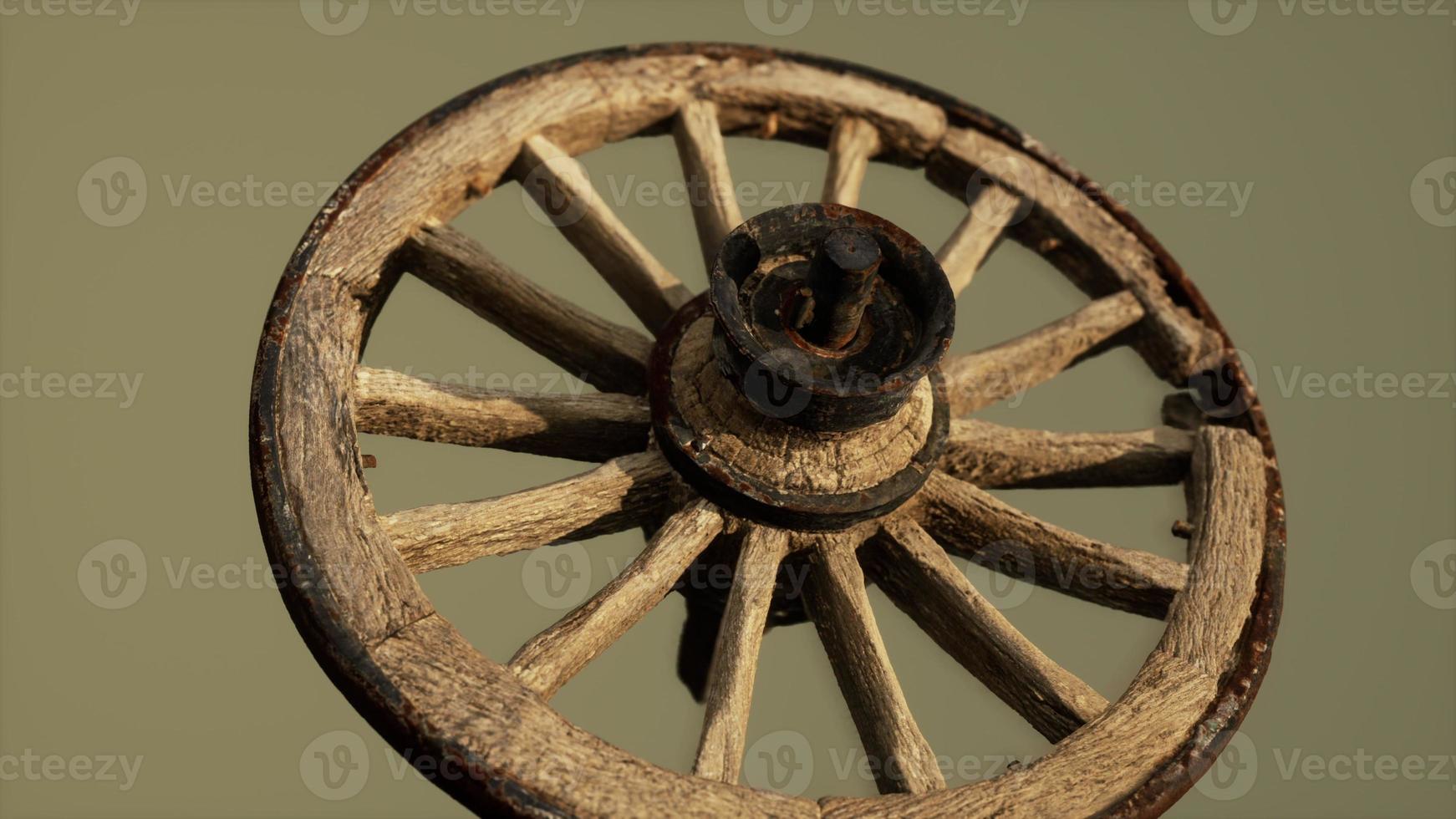 Handmade rustic vintage wooden wheel used in medieval wagons photo