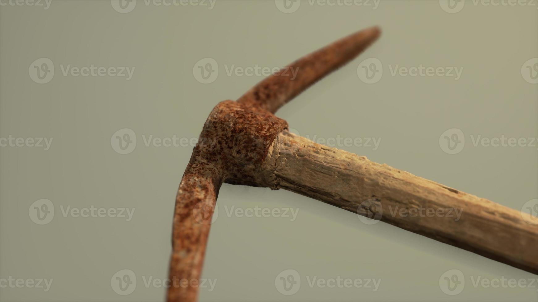 Close up of an old rusted pickaxe head photo