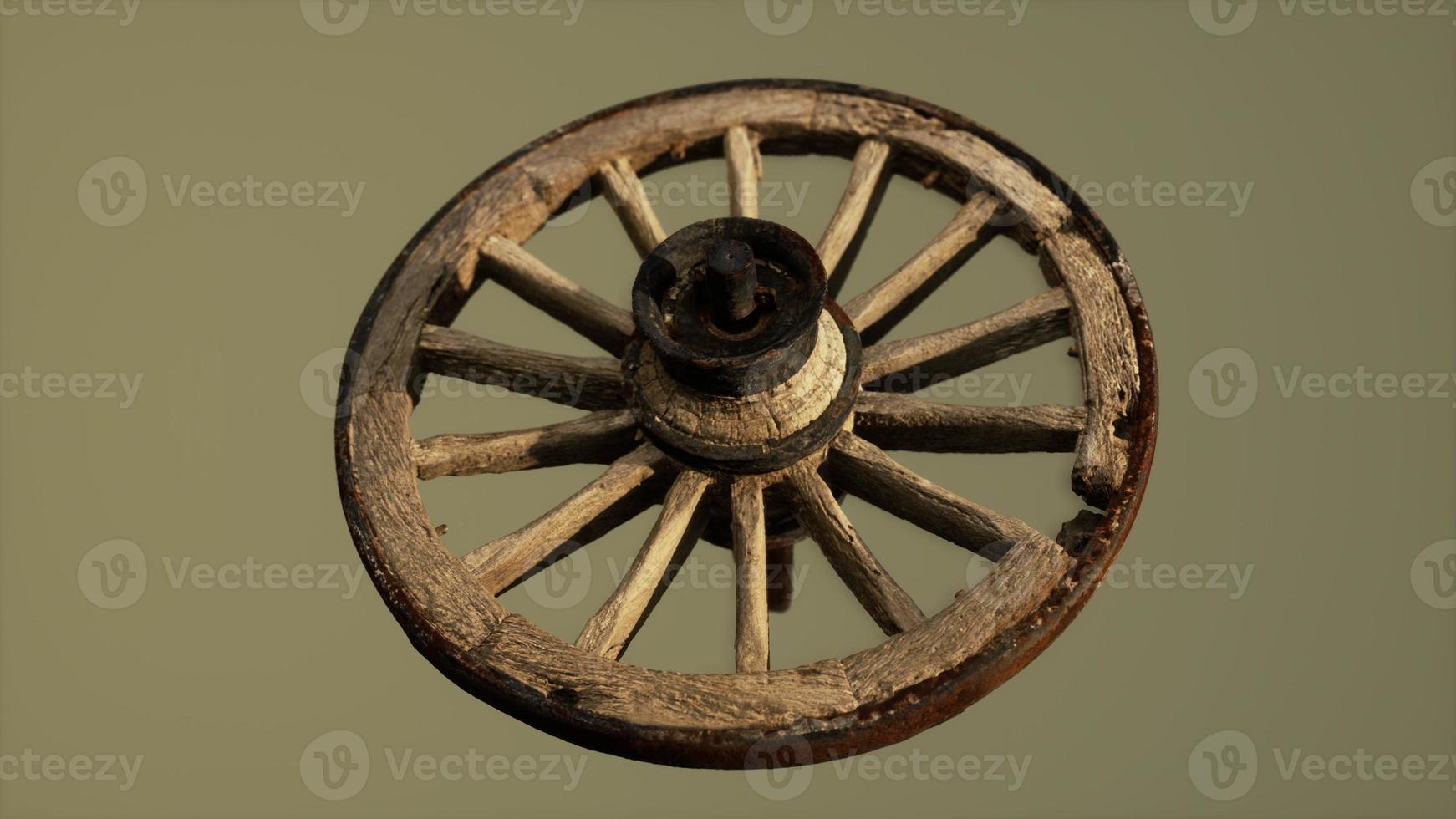 Handmade rustic vintage wooden wheel used in medieval wagons photo