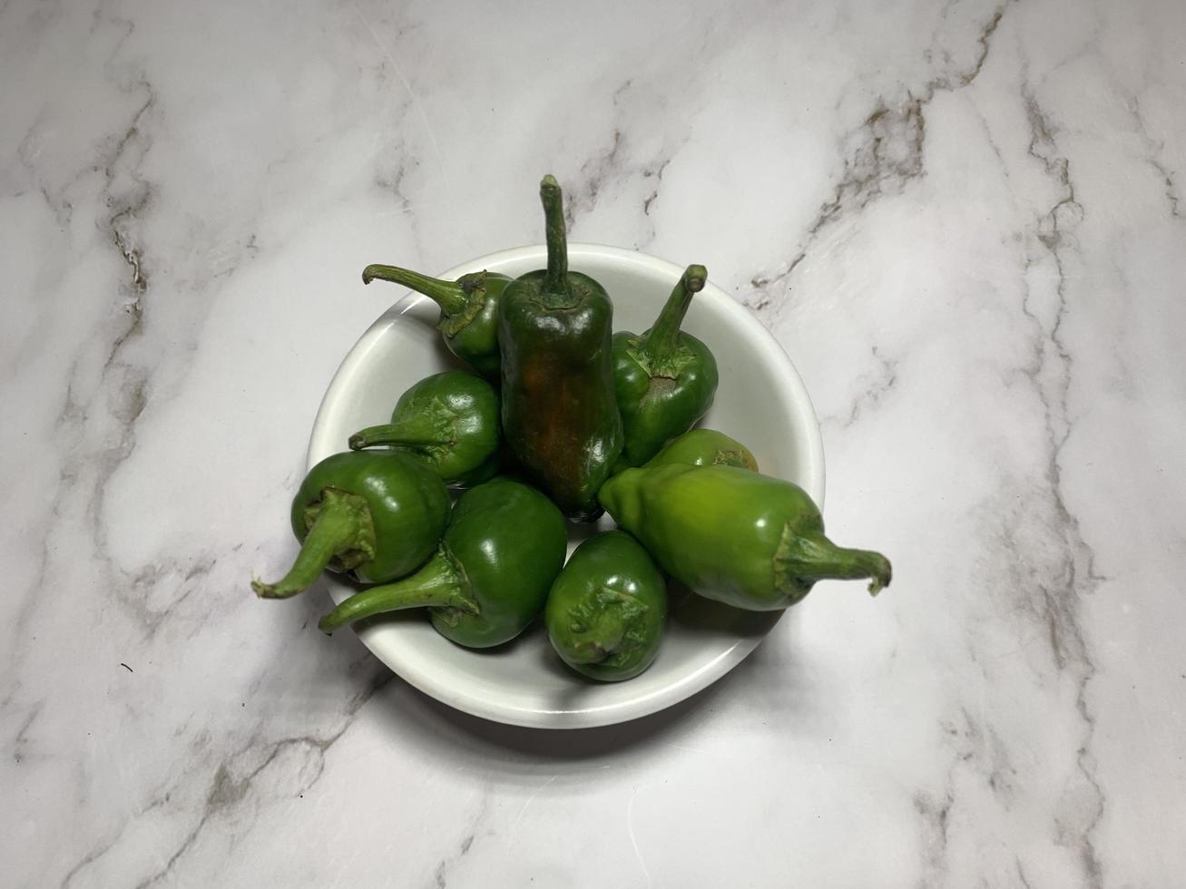 Green chili pepper or Hatch Double-X Hot chile. Numex or New Mexican pod type. Top view photo