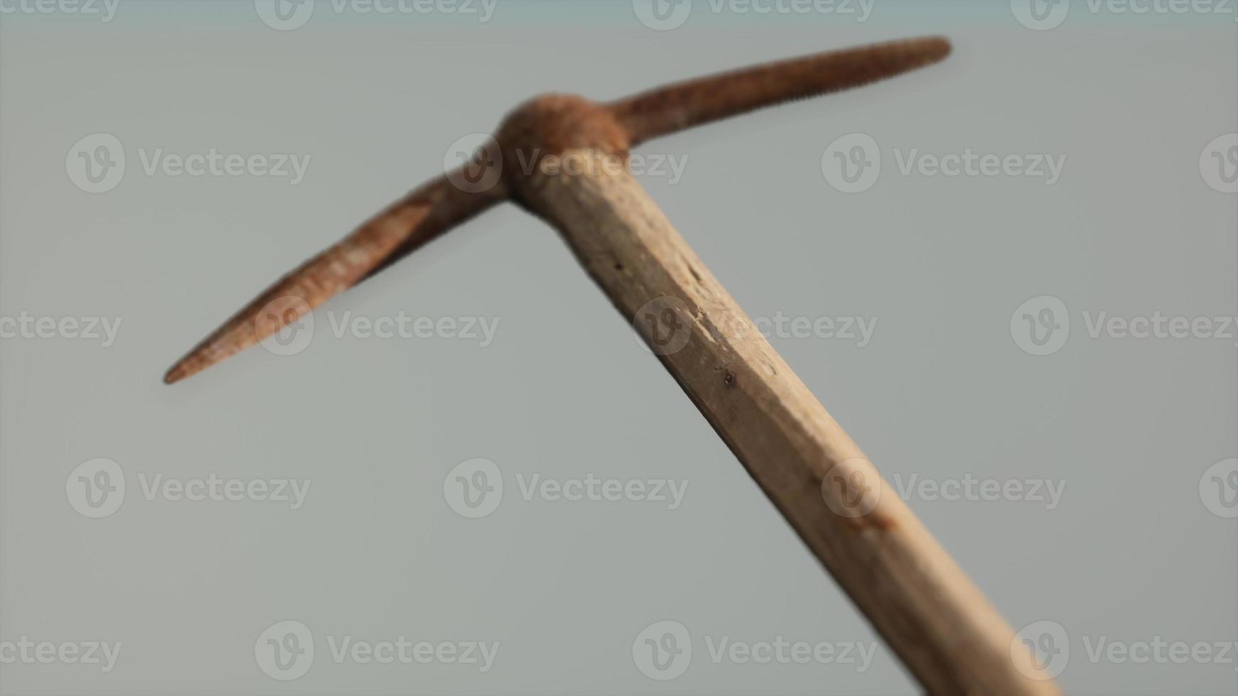 Close up of an old rusted pickaxe head photo