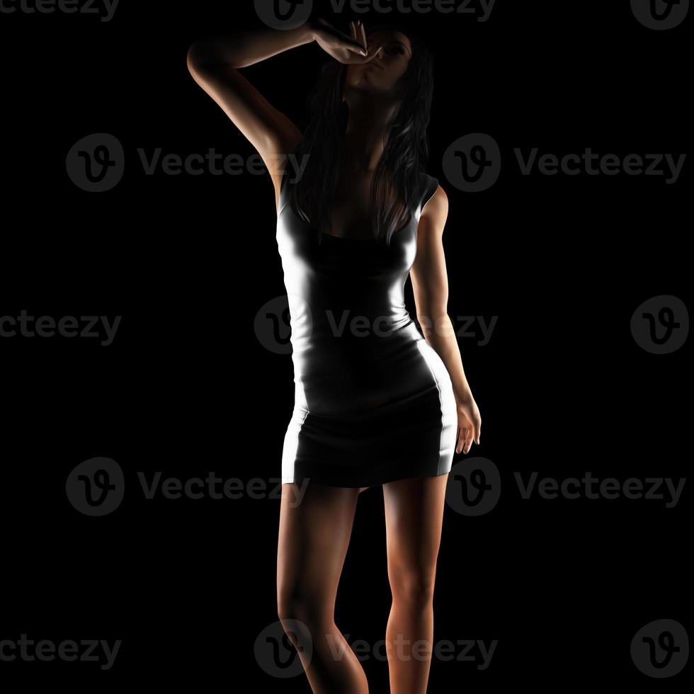 Sexy brunette woman posing in dark studio photo