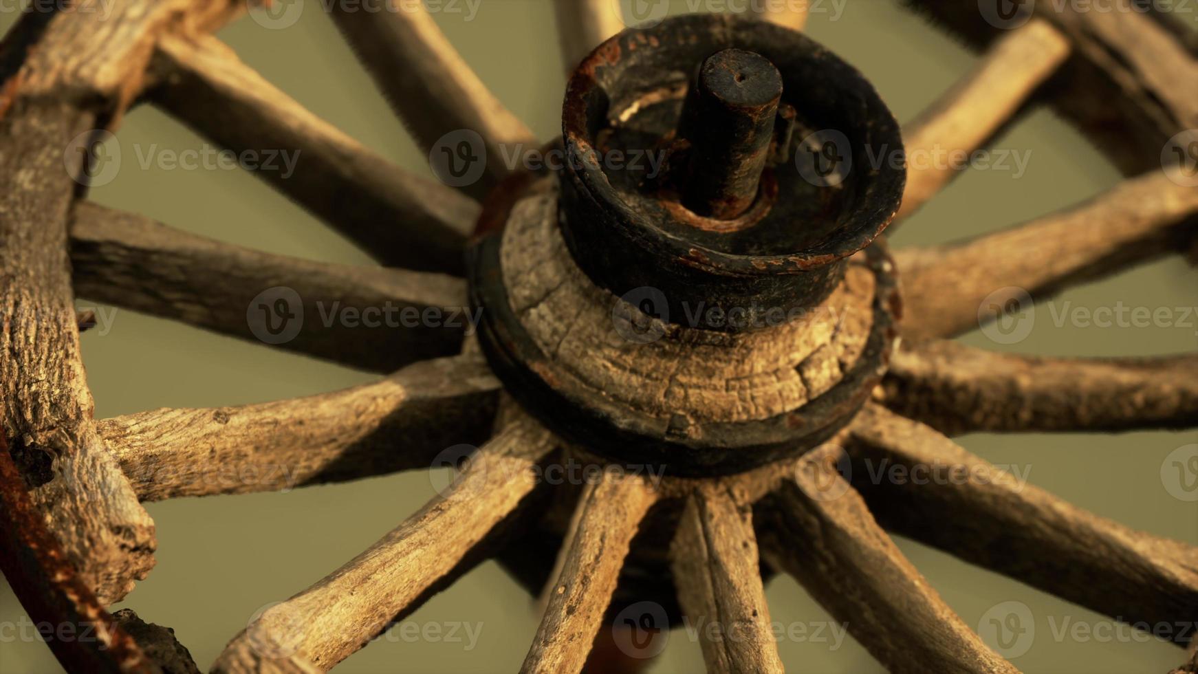 Handmade rustic vintage wooden wheel used in medieval wagons photo