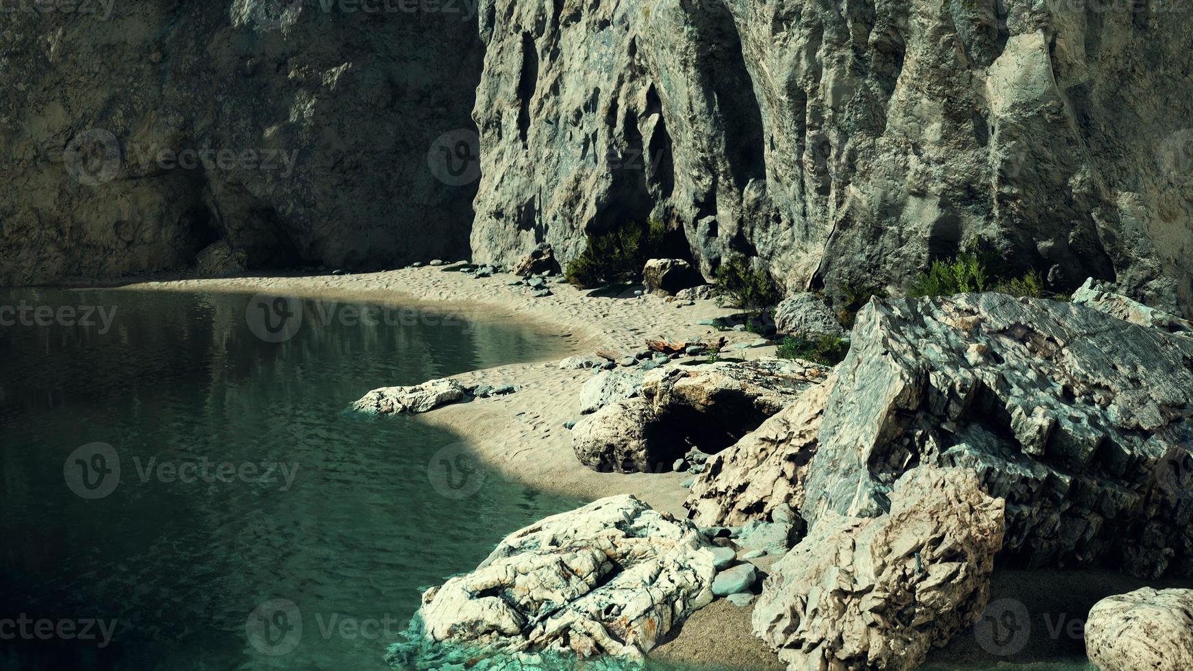 beach coast of the Norwegian Sea with mountains and cliffs on sunny day photo