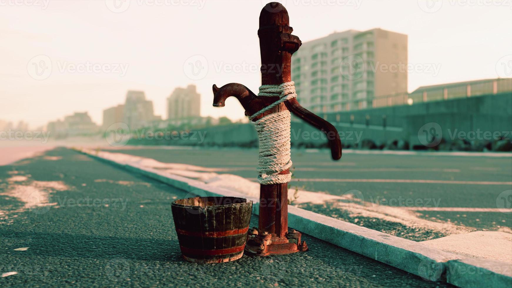 old rusty water pump at sunny day photo