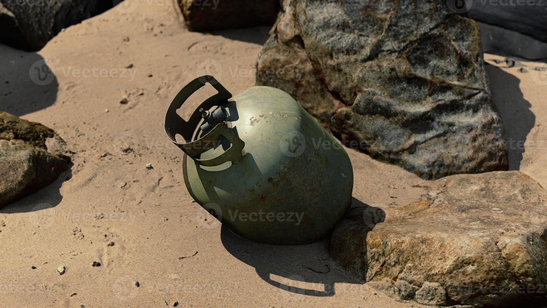 old cooking gas cylinder on sand beach photo