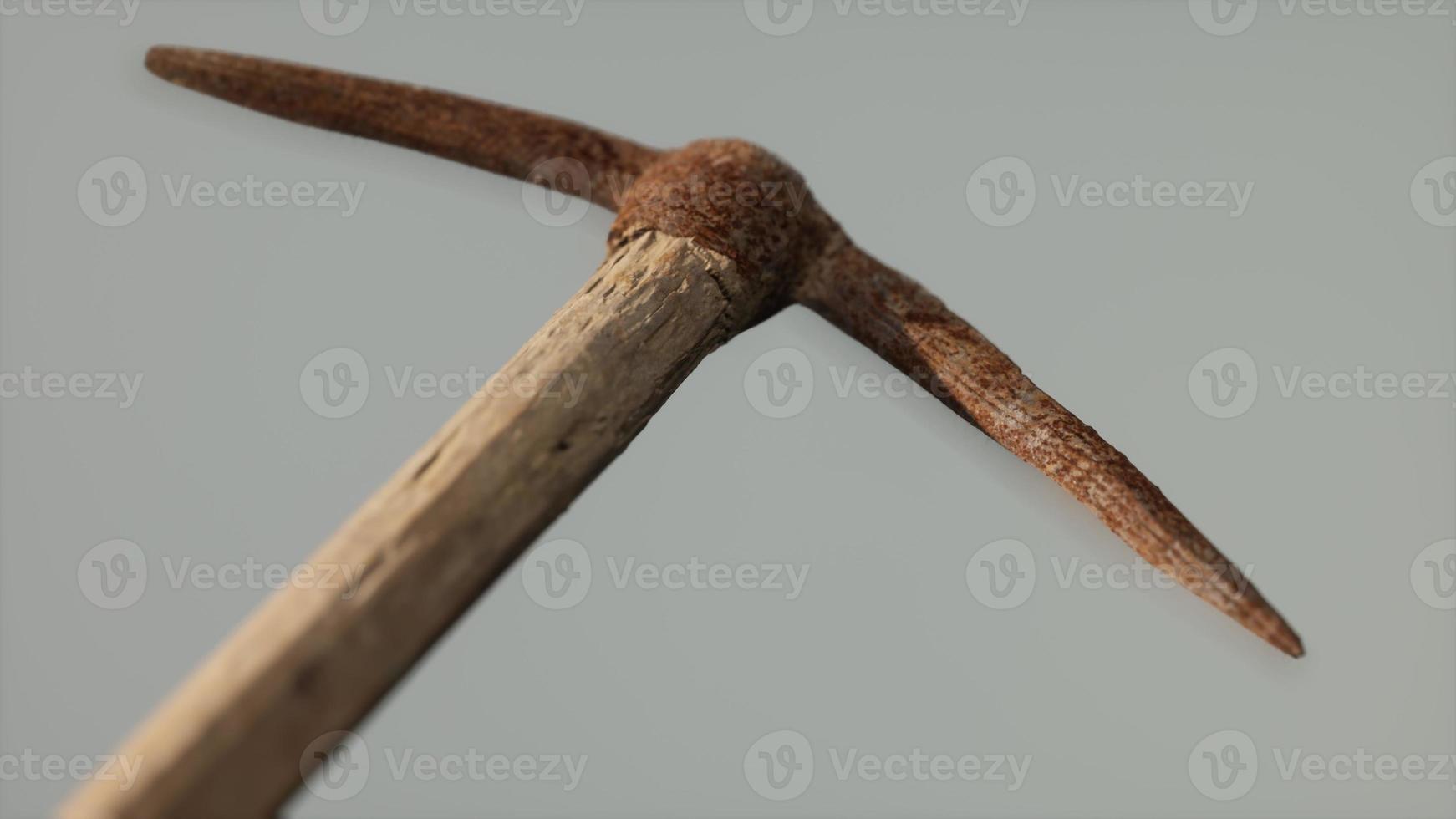 Close up of an old rusted pickaxe head photo